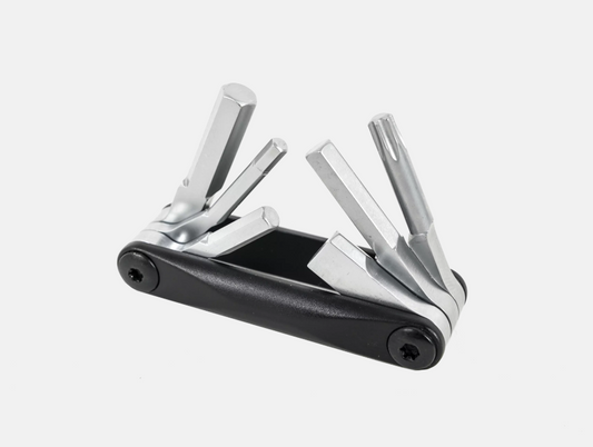 Multi-tool with multiple components on a white background
